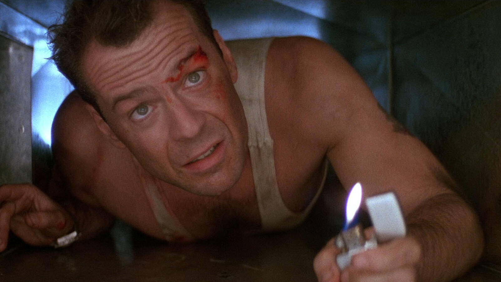 "Come out to the coast, we'll get together, have a few laughs." Ikonisk scen från Die Hard med Bruce Willis. Foto: 20th Century Fox.